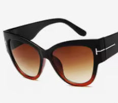 Sunglasses with black frame and brown gradient lenses on a white background