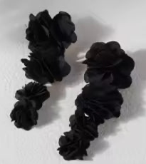 Black hair ties on a white background
