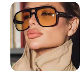 Person wearing large sunglasses with a blurred background