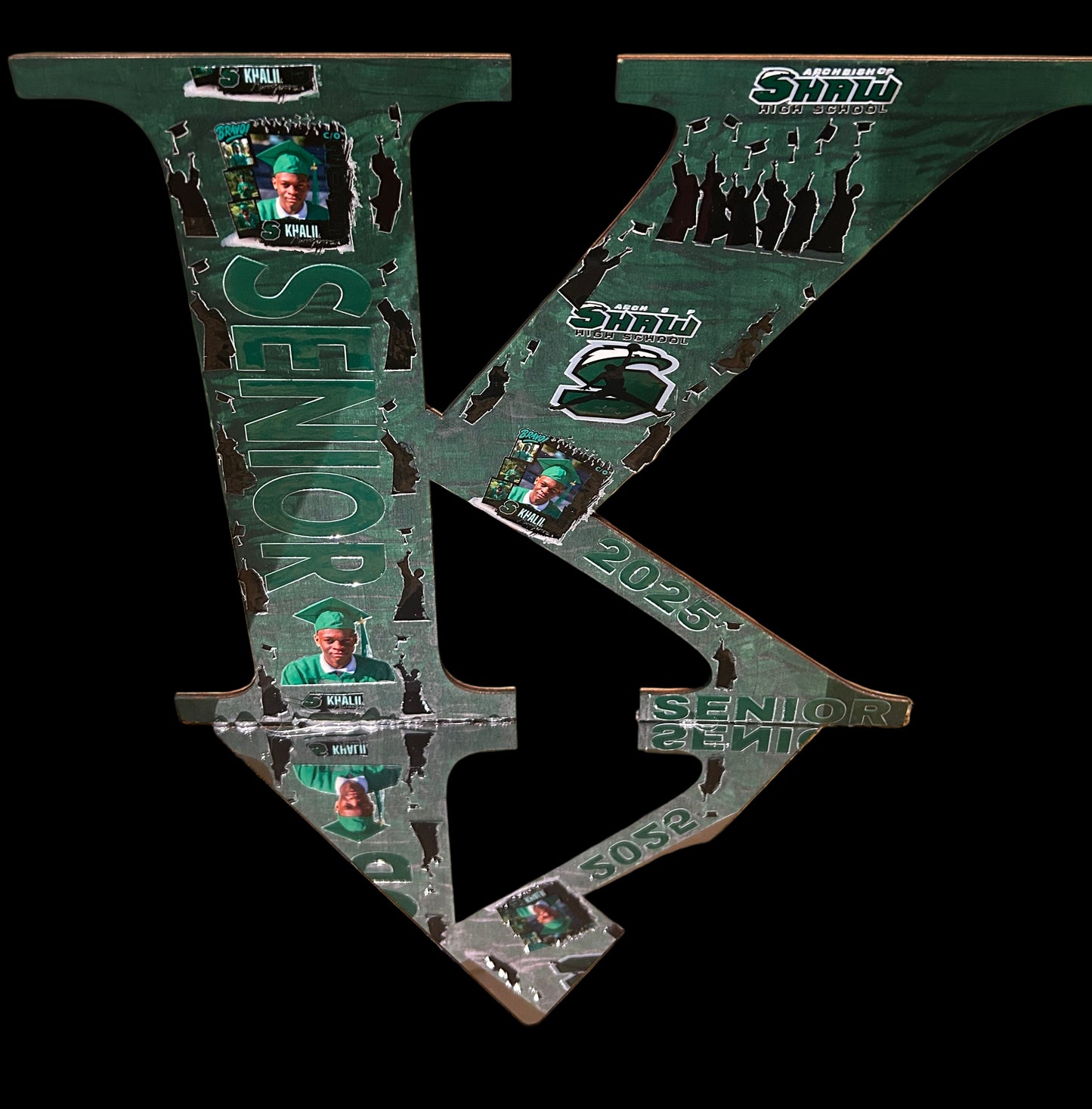 Green archery bow stand with 'Senior' branding on a brown surface